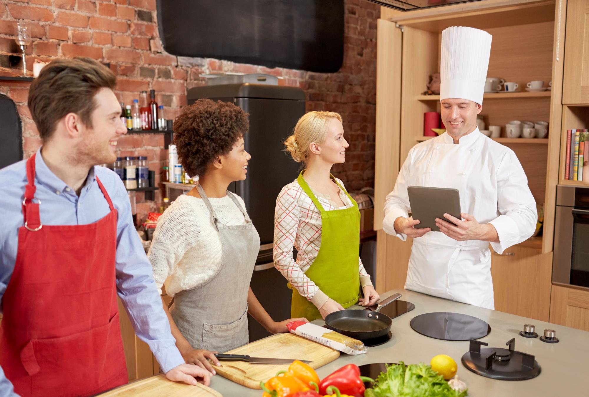 Chef teaching in a small studio kitchen