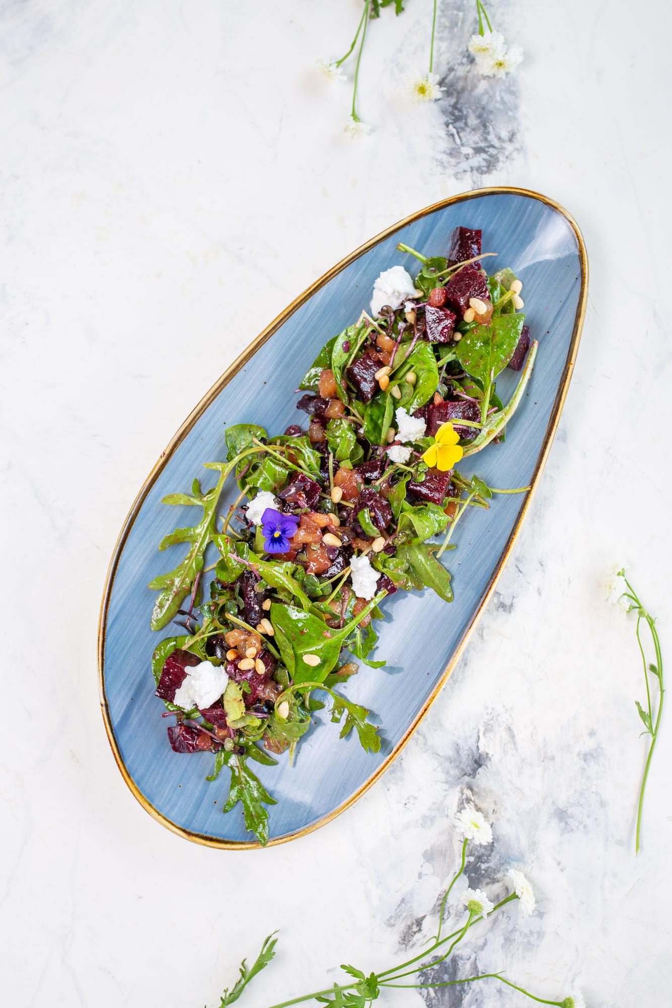 Plated seasonal salad with herbs